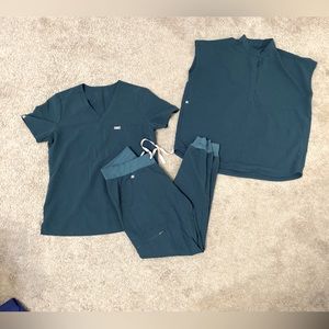 Figs scrubs set with two tops style and a joggers bottom.